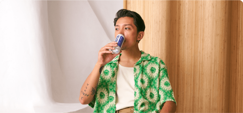 Man drinking Nguyen Coffee Cold Brew Can